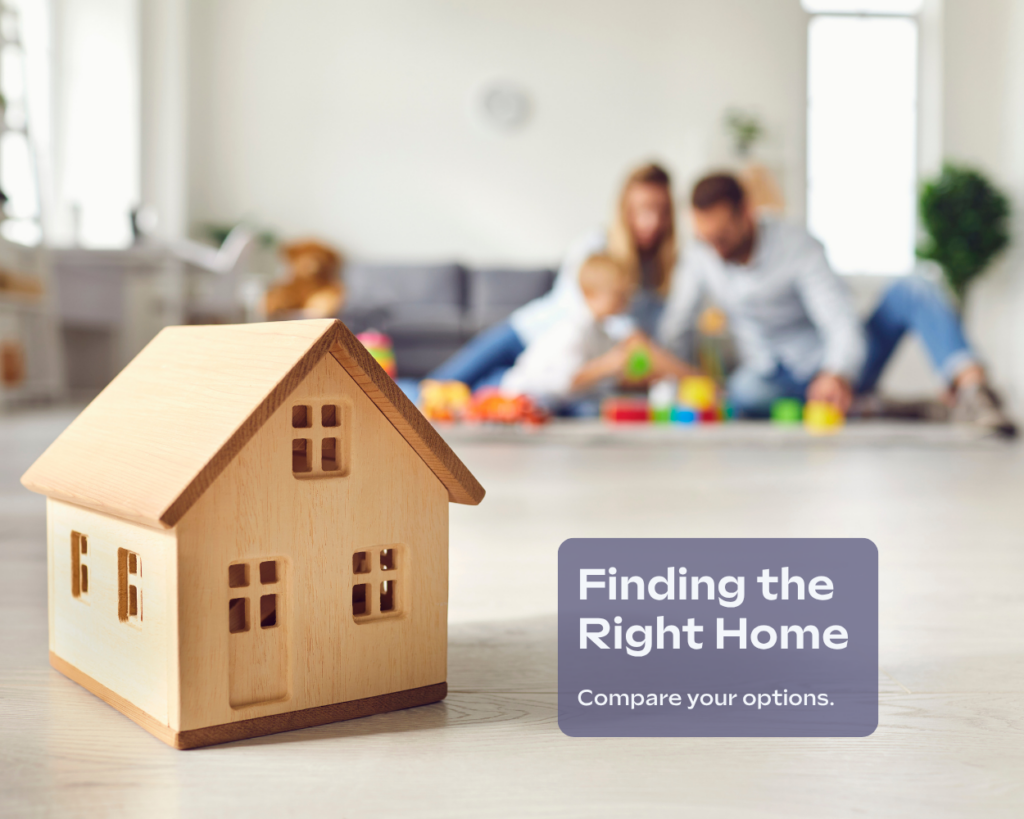 Wooden model house in front of a family representing different types of homes for first-time homebuyers