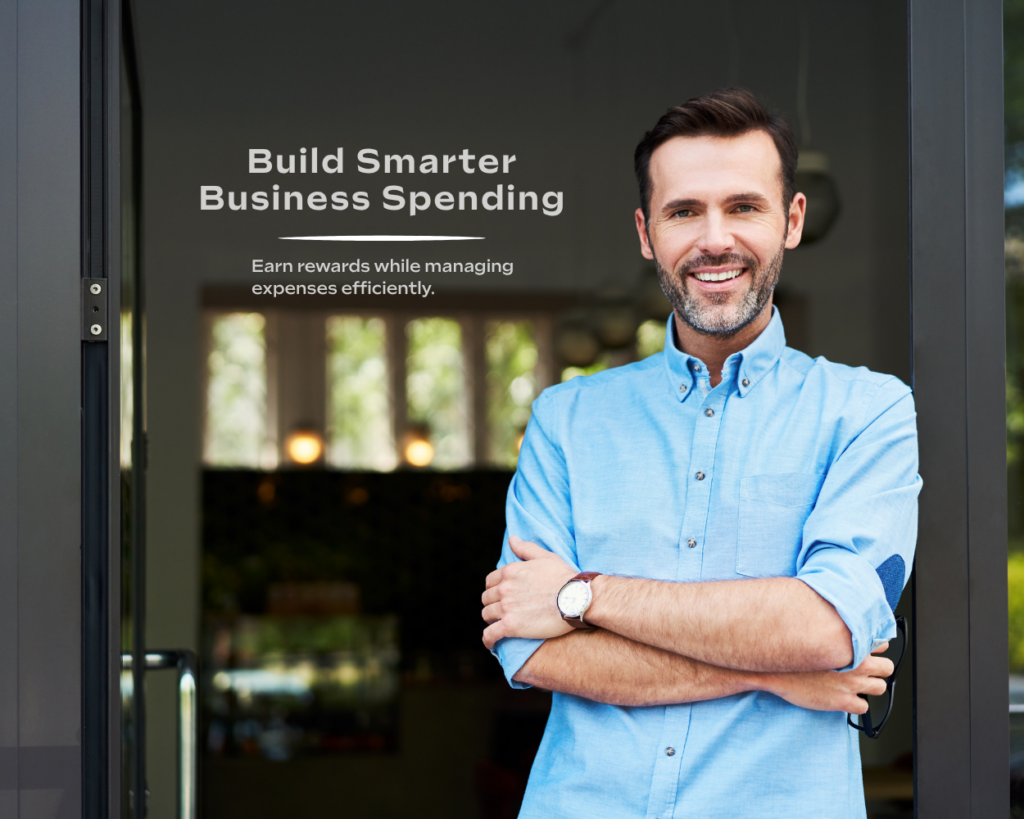 Small business owner standing outside while learning about business credit card benefits, rewards, and expense management tools.