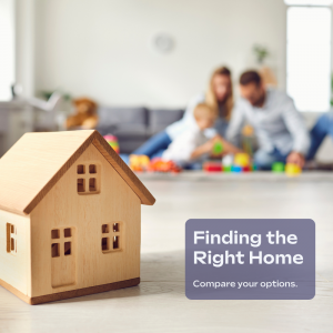 Wooden model house in front of a family representing different types of homes for first-time homebuyers